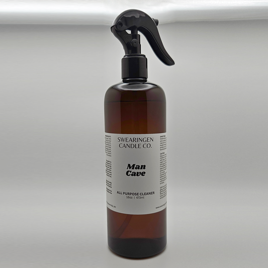 Man Cave all purpose cleaner in an amber plastic spray bottle, shown from the front - Swearingen Candle Co.