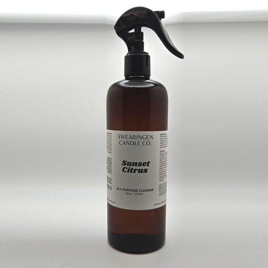 Sunset Citrus all purpose cleaner in an amber plastic spray bottle, shown from the front - Swearingen Candle Co.